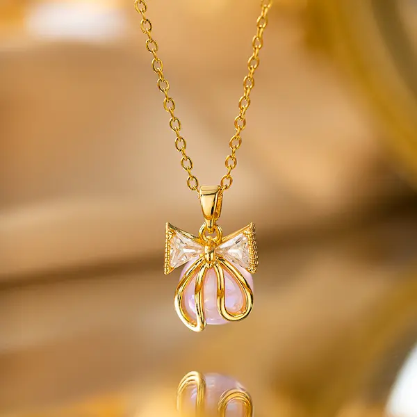 Pearl bow necklace . stainless steel chain and  pendant material copper 225